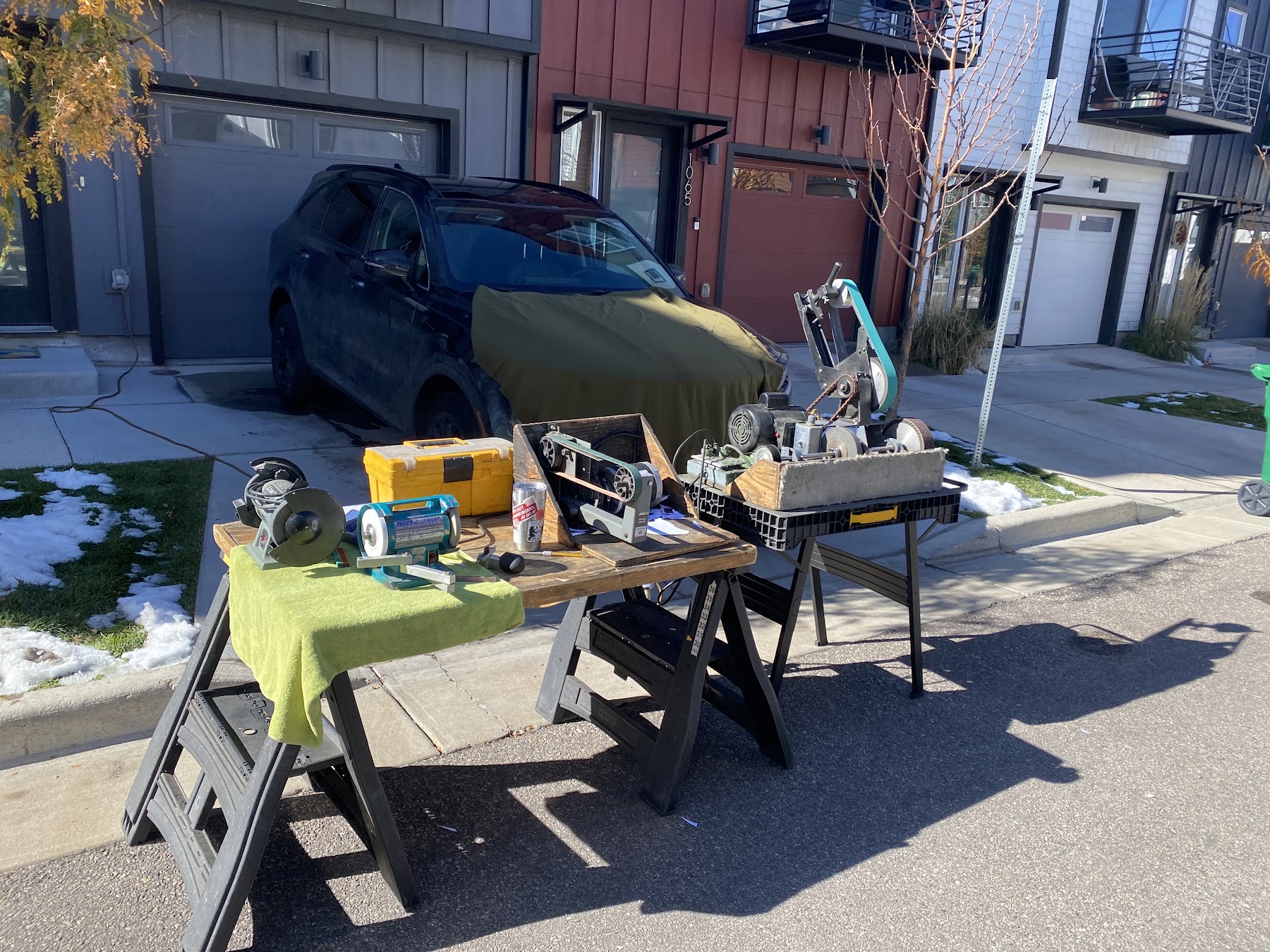 Afia's sharpening equipment set up outdoors for local service